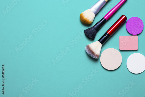 Set of colorful cosmetics on colorful background