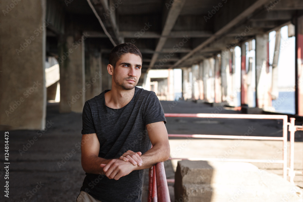 Portrait of a man in the urban space. Portrait of a man in the urban space.