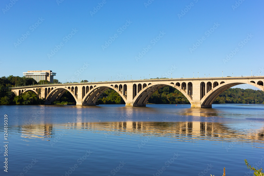 Key Bridge over Potomac River, Washington DC, USA. A view on the bridge from Georgetown Park in US capital. Key Bridge over Potomac River, Washington DC, USA. A view on the bridge from Georgetown Park in US capital.