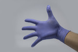 Women hands holding Wear rubber gloves on a white background.
