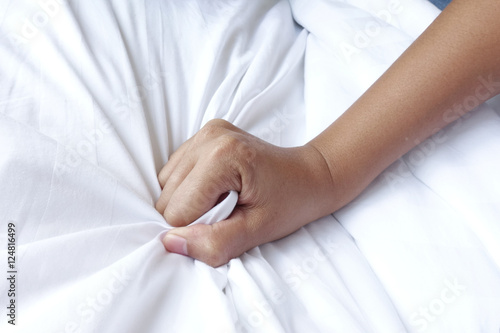 Bilde på lerret hand of women pulling white sheets in ecstasy, orgasm.