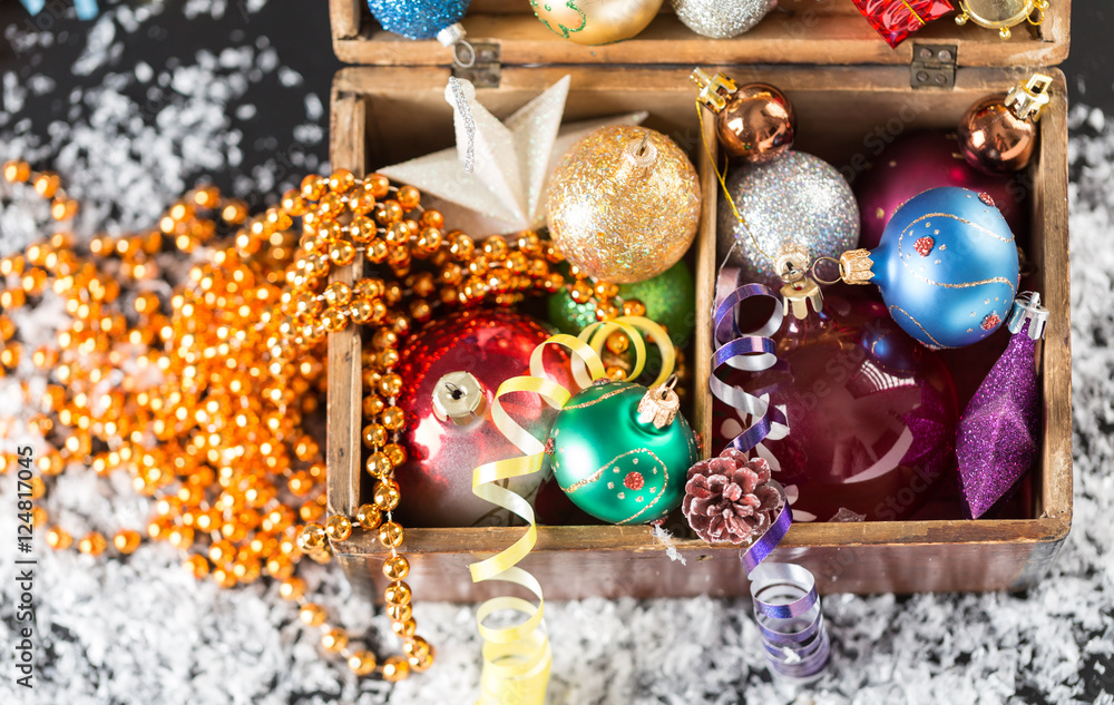 Colorful Christmas balls in a old wooden box Colorful Christmas balls in a old wooden box