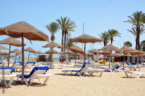 Parasols and sun loungers on a sandy beach in Sousse.Tunisia 