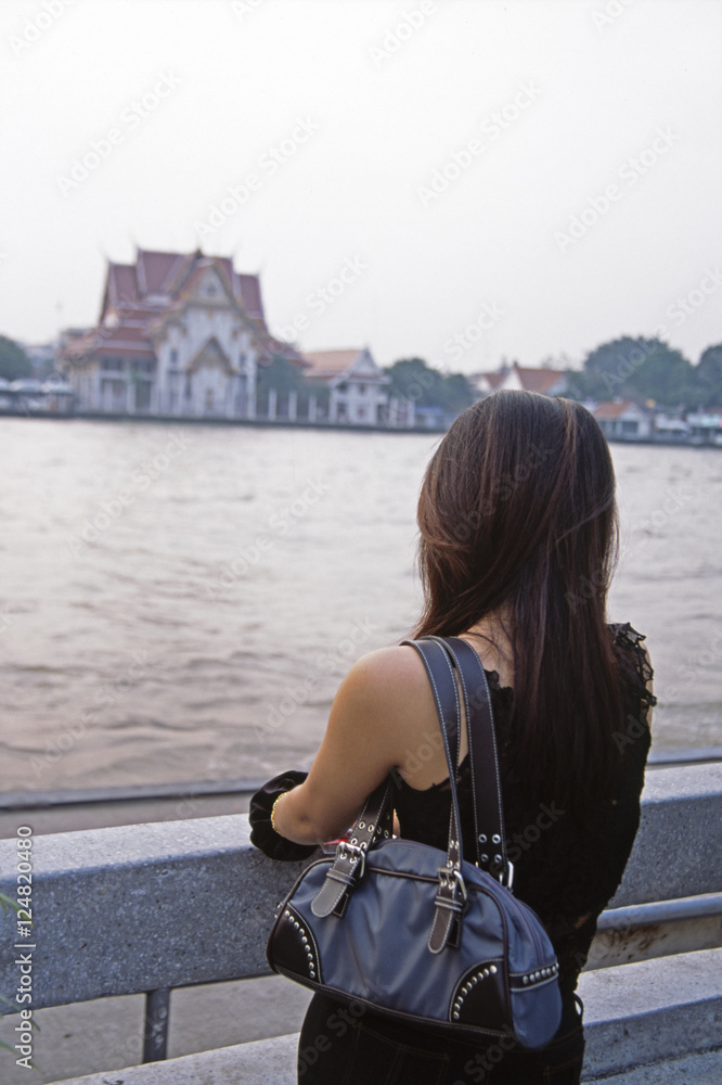 Fototapeta premium woman looking at river