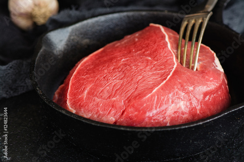 Beef  sirloin in  iron skilet photo