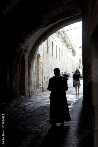 people walking n tunnel