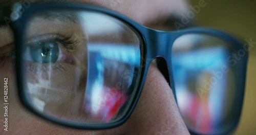 Wallpaper Mural Close up of young businessman with blue eyes wearing the glasses looking on the waveform lines expressed concept of stock market, growth stock market, economic profits, stock exchange  Torontodigital.ca