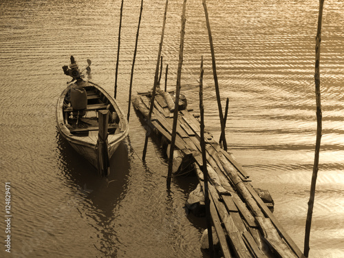 Old wooden boat at wharf photo