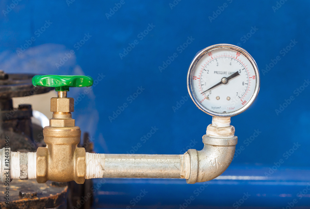 Water gauge pressure and valve in control room. Water gauge pressure and valve in control room.