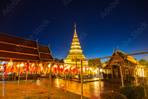 Festival lanterns hanging colorful night dark inside Wat Phra Haripunchai. Lamphun Thailand background