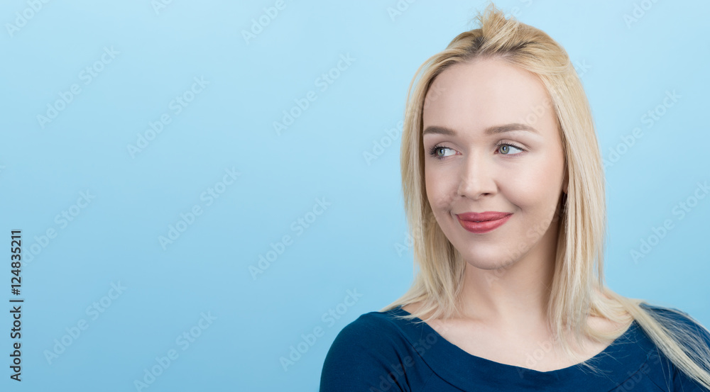 beautiful blond woman against blue background beautiful blond woman against blue background