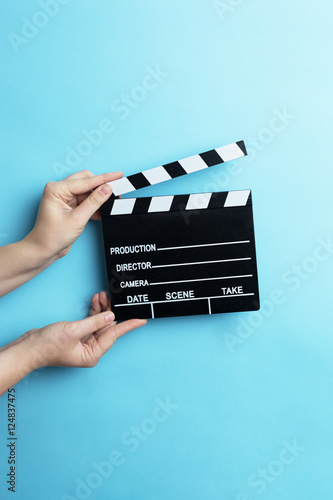 movie clapper on blue background, cinema concept