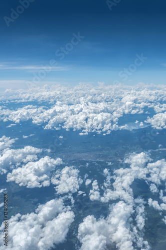 Skyline at air plane above clouds with city view under cloud,aerial view landscape.