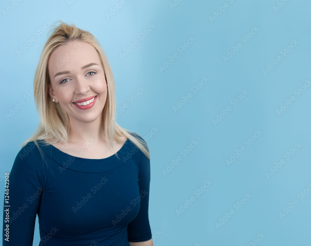 Fototapeta premium beautiful blond woman against blue background