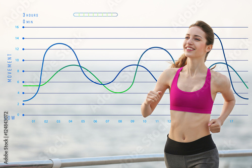 Young woman jogging on pier...