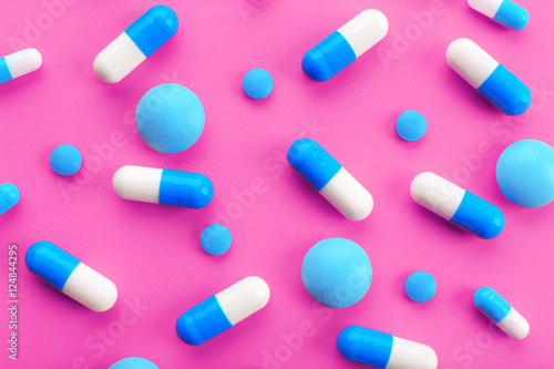 Color pills on pink background