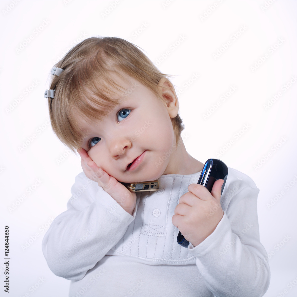 little funny girl with two mobile phones