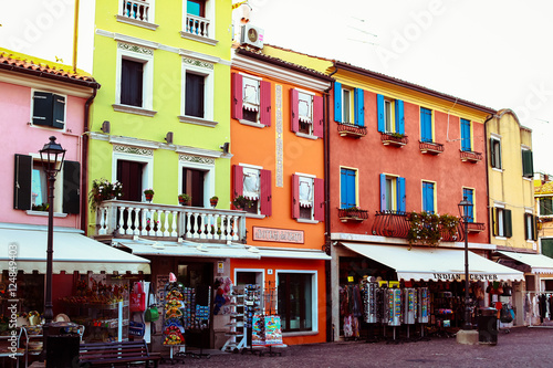 Colorful houses with little stores stand on the street