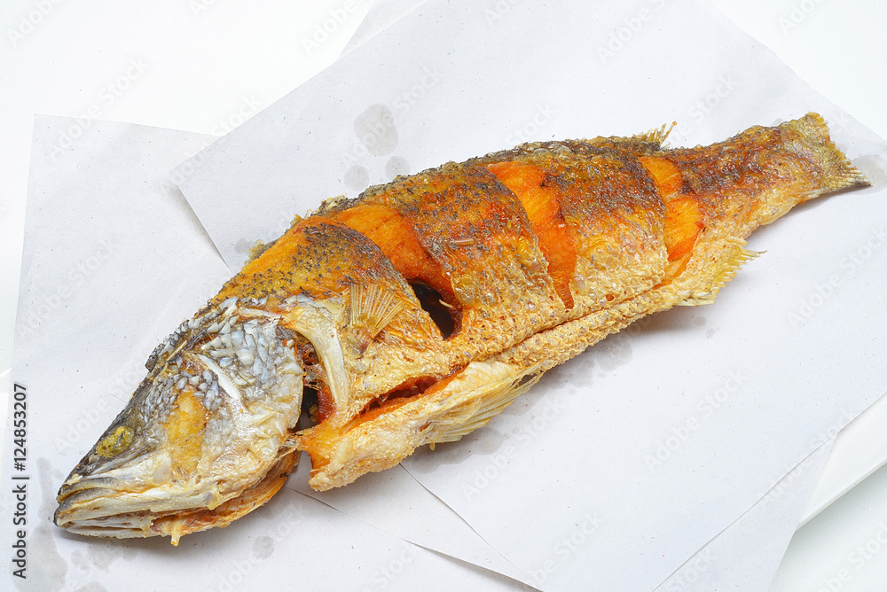 Close up of fried Barramundi or Asian seabass (Lates calcarifer) fish
Close up of fried Barramundi or Asian seabass (Lates calcarifer) fish