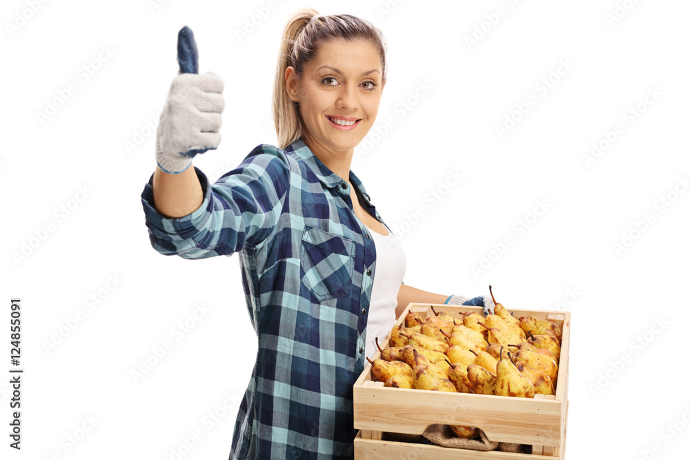 Female farmer giving a thumb up and holding a crate Female farmer giving a thumb up and holding a crate
