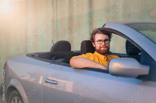 Man in his brand new car