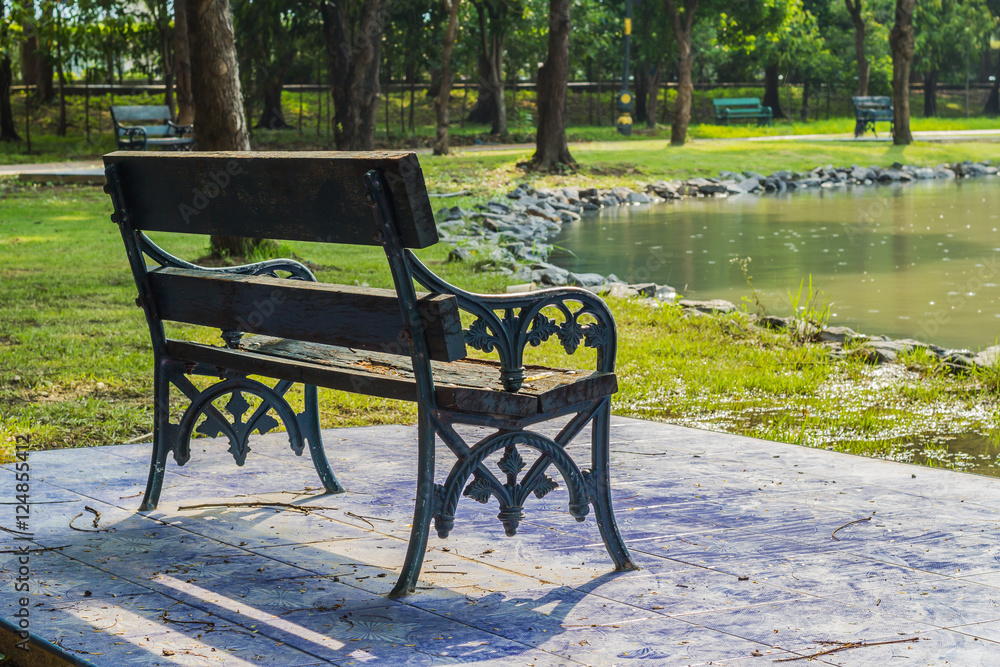 Empty Bench in the park for relaxing aisle. Empty Bench in the park for relaxing aisle.
