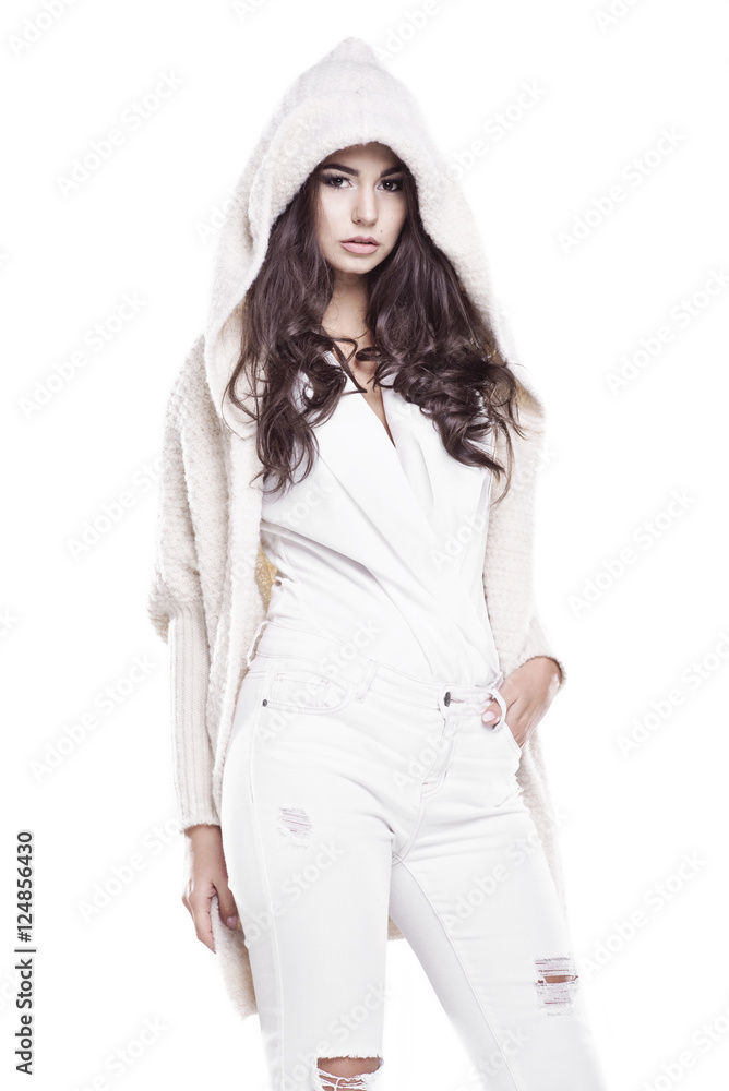 Beautiful woman wearing a warm sweater standing on a white background Beautiful woman wearing a warm sweater standing on a white background