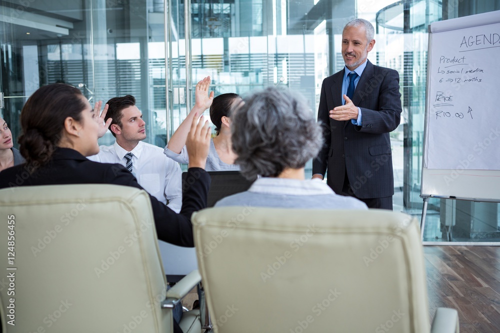 Businessman interacting with coworkers Businessman interacting with coworkers