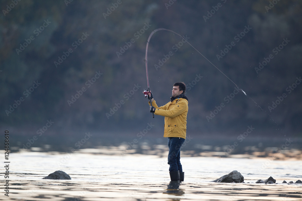 Man fishing on river