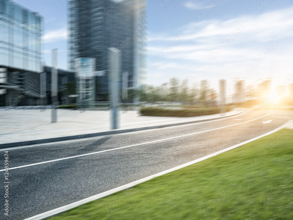 empty asphalt road by modern office building. empty asphalt road by modern office building.