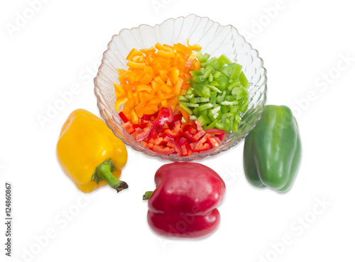 Chopped yellow, red and green bell peppers and whole peppers