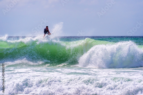 Canvas Print Surfer riding a huge wave in Lacanau, France