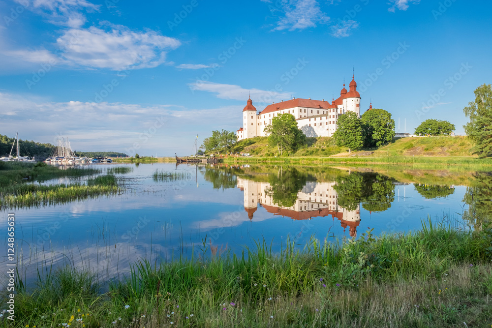 Summer evening by Lake Vanern and Lacko Castle. Lacko Castle is considered as one of the most beautiful castles in Sweden. Summer evening by Lake Vanern and Lacko Castle. Lacko Castle is considered as one of the most beautiful castles in Sweden.