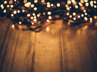 christmas fairy lights on a wooden table,studio shot.