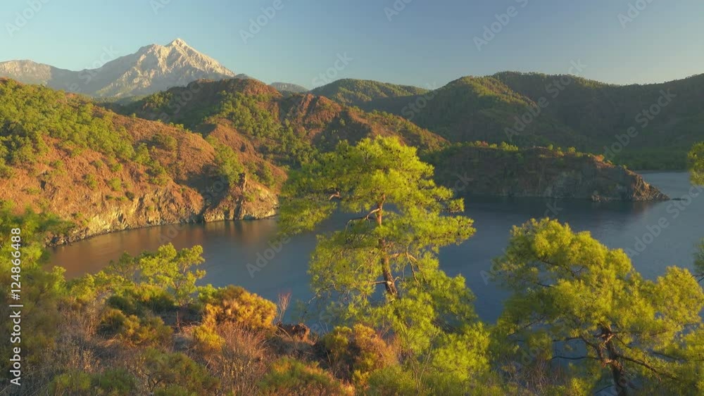View from Lycian way to blue lagoon and Tahtali mauntain in Turkey. Panning shot, UHD, 4K
View from Lycian way to blue lagoon and Tahtali mauntain in Turkey. Panning shot, UHD, 4K