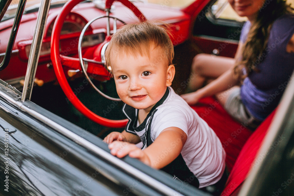 Adorable baby boy in the car