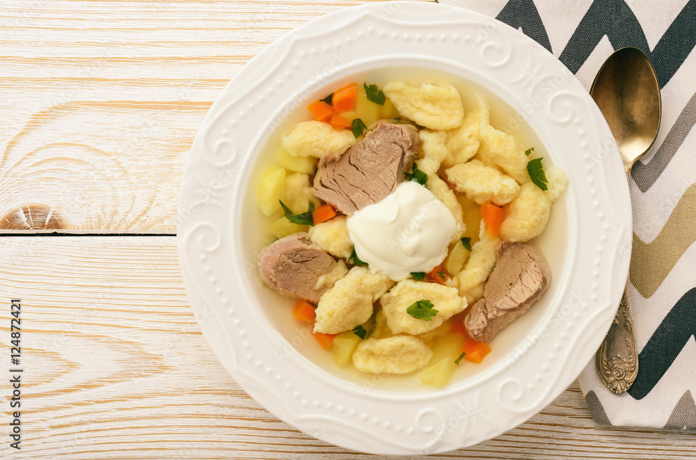 Meat soup with dumplings on white background. Meat soup with dumplings on white background.