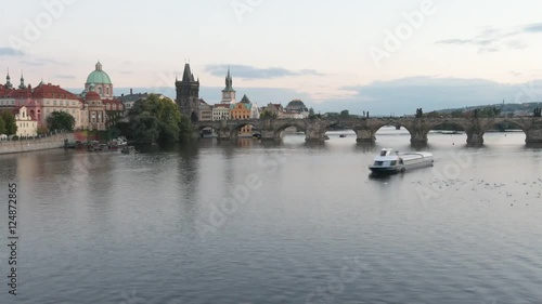 HD timelapse of a bridge with a boats floating down the river.