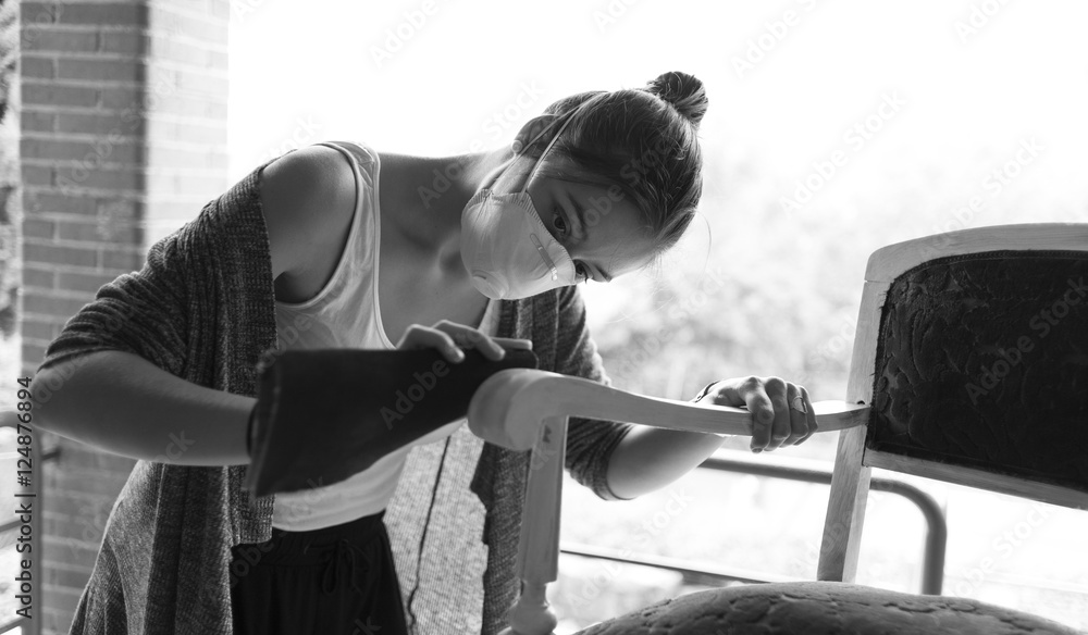 young woman restoring her chair