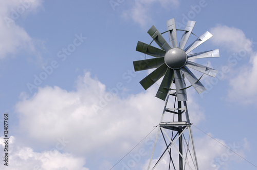 Traditional Metal windmill in blue sky