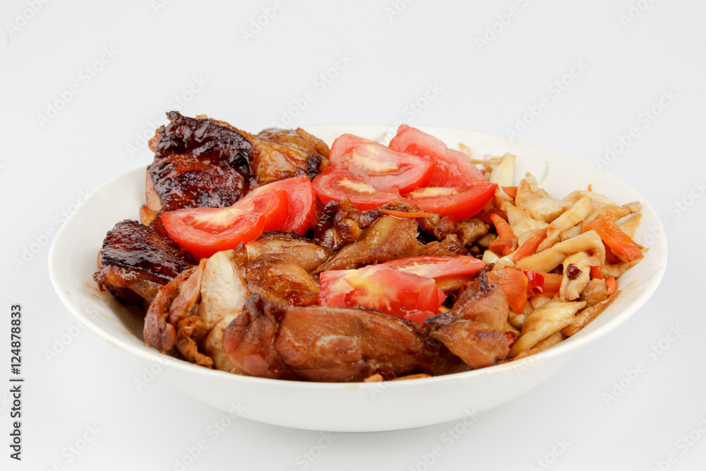 tomatoes and Chicken legs on white plate tomatoes and Chicken legs on white plate