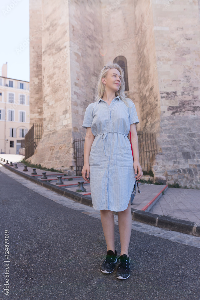 Portrait of a Stylish Pretty Young Woman traveling throug city Portrait of a Stylish Pretty Young Woman traveling throug city