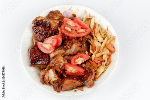 tomatoes and Chicken legs on white plate