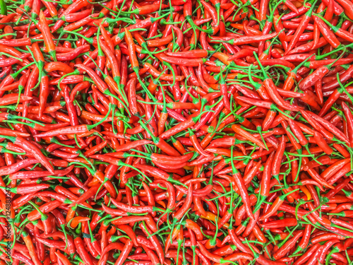 Closeup surface pile of red pepper or red paprika textured background © kenkuza
