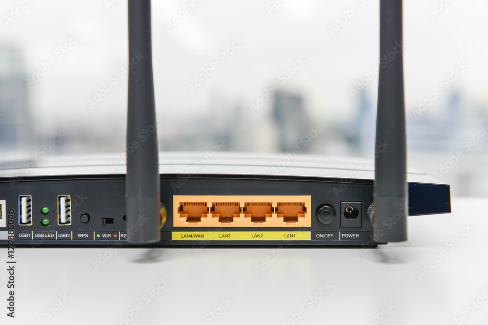 Back panel of black wifi router on the white table Stock-foto | Adobe Stock