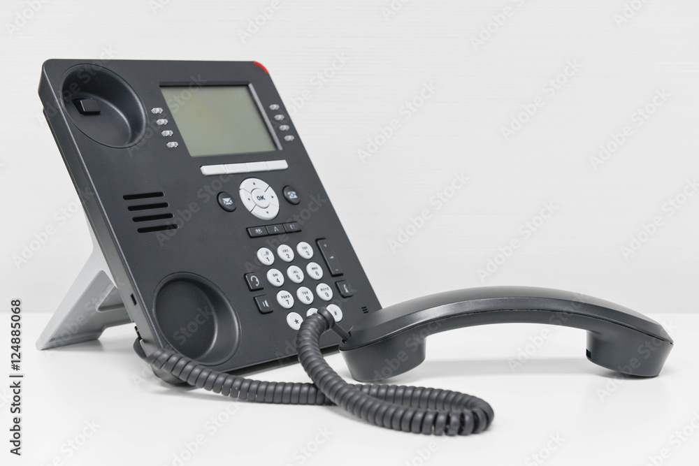Black IP Phone and handset on the white table Black IP Phone and handset on the white table