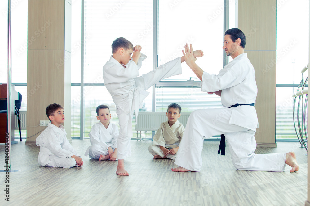 young, beautiful, successful multi ethical kids in karate positi young, beautiful, successful multi ethical kids in karate positi