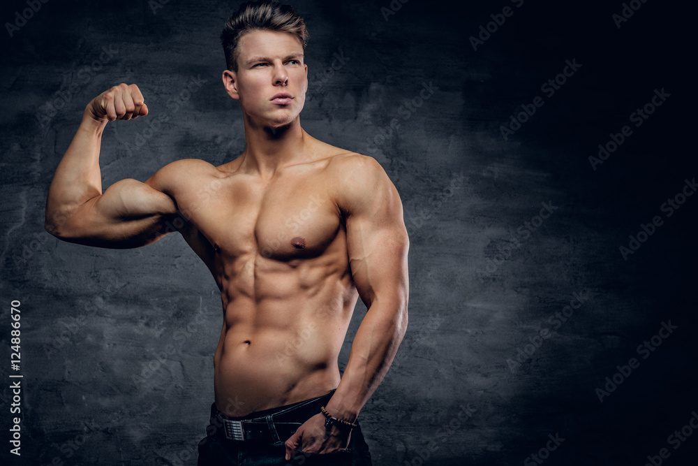 Fototapeta premium Shirtless athletic male showing biceps.