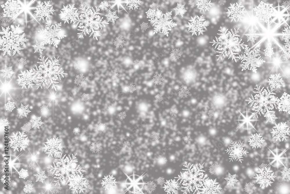 Christmas background with snowflakes, stars and place for text. Sparkly holiday background with copy space. Gray and silver background Christmas background with snowflakes, stars and place for text. Sparkly holiday background with copy space. Gray and silver background