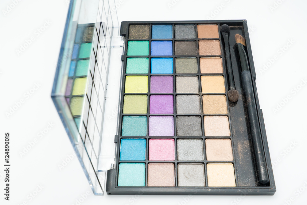 Palette of colorful eye shadows with brush isolated on white background Palette of colorful eye shadows with brush isolated on white background